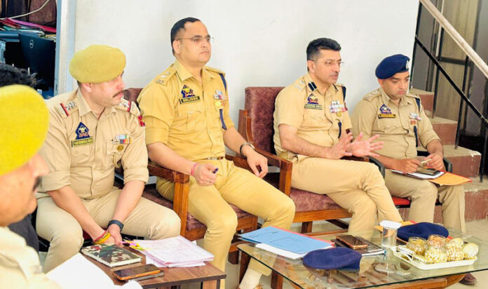 SSP Joginder Singh chairing a meeting of police officers in Jammu district on Saturday.