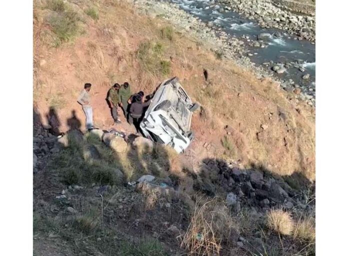 Ill fated car lying in a Nallah in Darhal area of Rajouri. -Excelsior/Imran
