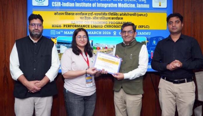 Dr Zabeer Ahmed, Director CSIR-IIIM presenting certificate to a student during a function in Jammu.