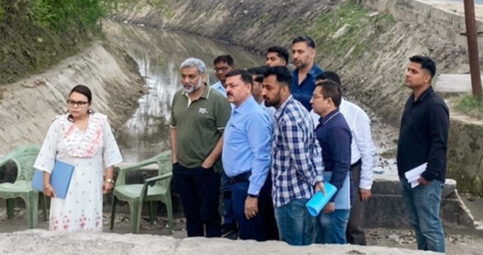 ACS Shaleen Kabra inspecting canal in Jammu on Saturday.