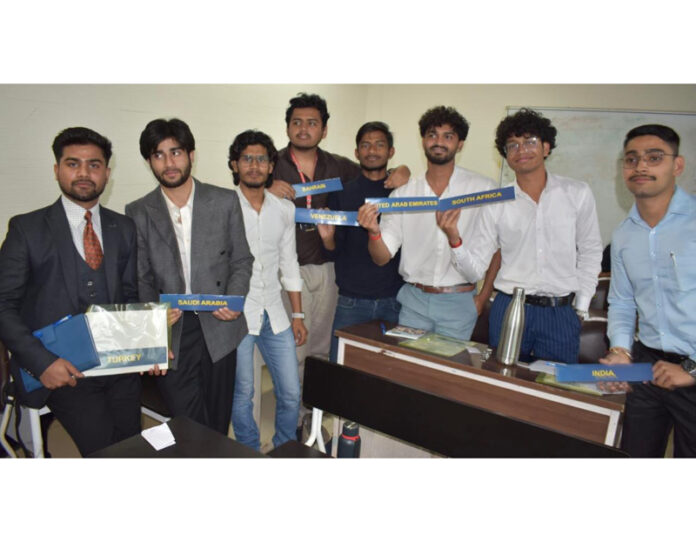 Delegates (students) posing for a group photograph during the programme.