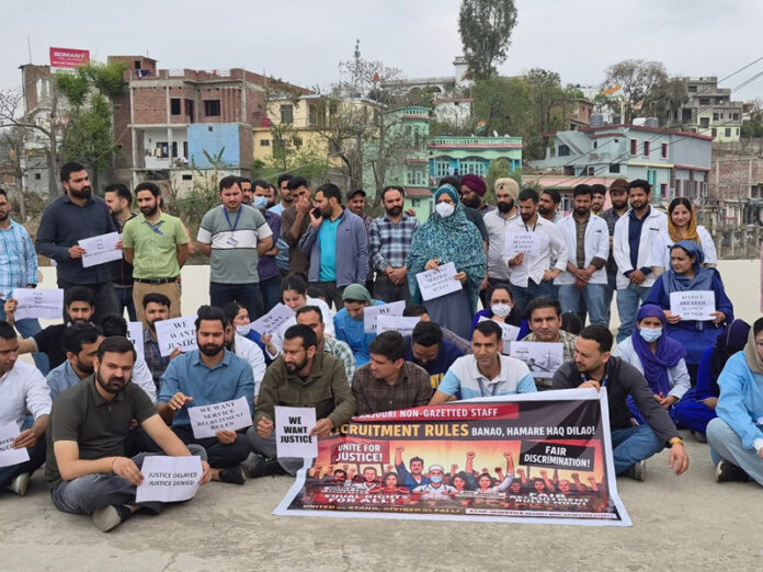 Non-gazetted employees of GMC Rajouri staging protest on Monday. -Excelsior/Imran