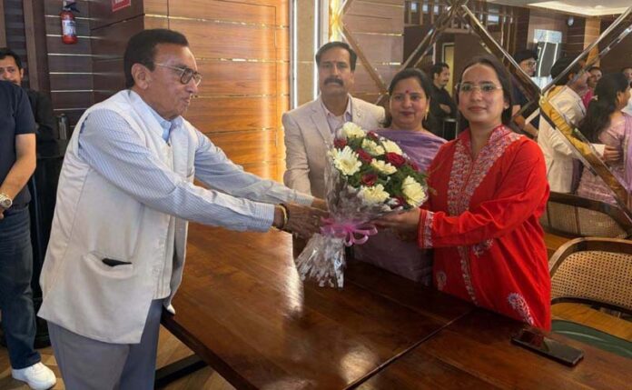 Deeksha Sharma being felicitated by National Convenor VBKP, Pt Daya Ram Sharma during a function in Jammu North on Sunday.