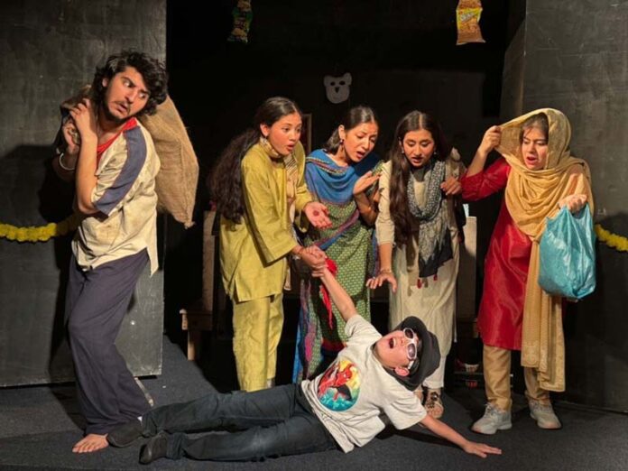 Artists performing during a play staged by Natrang in Jammu.