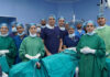 A team of doctors posing for a group photograph after performing bilateral breast interstitial brachytherapy at AIIMS Jammu.