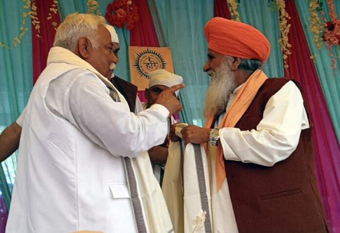 Ajay Sadhotra seeking blessings of Swami Gurdip Giri at Karwanda in Jammu on Saturday.