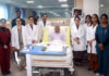 A team of doctors posing with a patient on whom it performed a highly complex surgery at AIIMS Jammu.