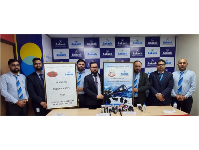 Officials of Indian Army, BSF and AESL posing after signing MoU on Friday. Officials of Indian Army, BSF and AESL posing after signing MoU on Friday.