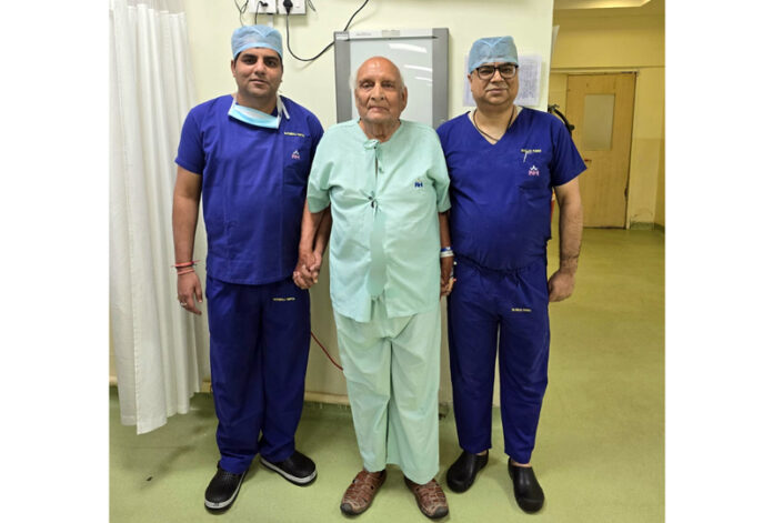Doctors at SMVD Narayana Hospital posing with Prof VK Dubey on whom they performed complex knee replacement.