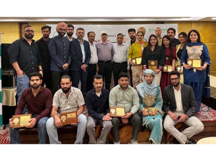 Dignitaries posing for a photograph during an event on World Kidney Day in Jammu.