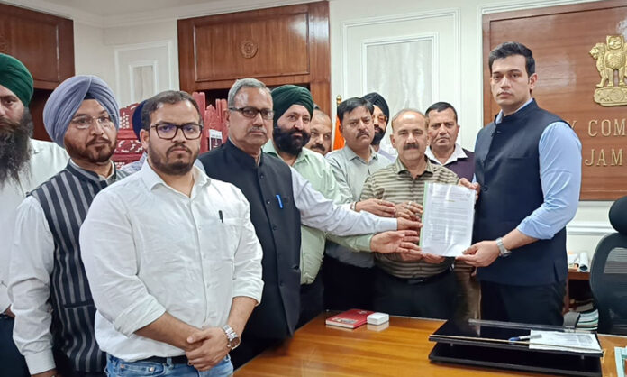 BJP delegation submitting a memorandum to DC Jammu, Rakesh Minhas in his office chamber on Monday.