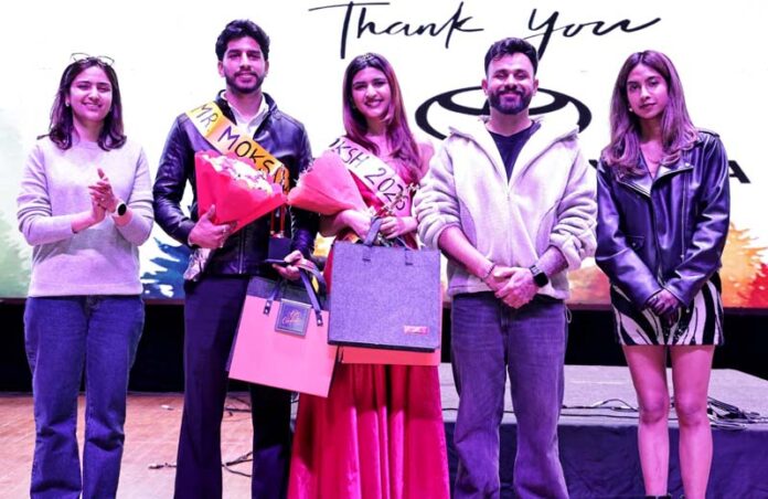 Winners of the titles, Mr Moksh and Ms Moksh posing along with others during a function at Shoolini University.
