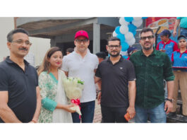 Dignitaries posing for a photograph after the inauguration of Domino's Pizza outlet in R.S Pura on Monday.