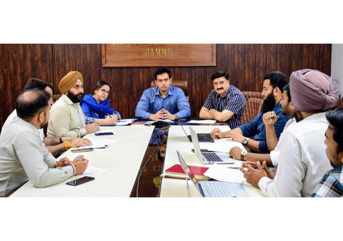 DM Jammu chairing a meeting on Saturday.