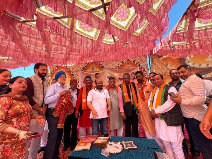 Bali Bhagat posing with other BJP leaders during a party programme in Marh on Sunday.
