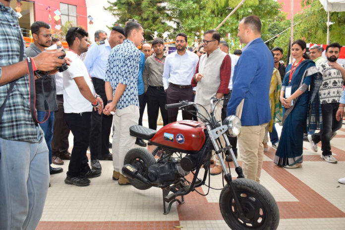 Guests interacting with participating teams during Smart Solution exhibition at SMVDU.