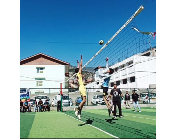 Volleyball players in action during a match in Doda.