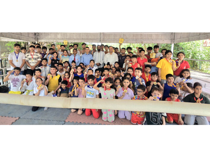 Players posing with dignitaries during award function of Muay Thai Championship at MA Stadium, Jammu.