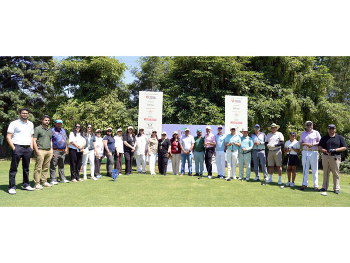 Dignitaries posing along with golfers during an event at Tawi Golf Course.