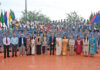 Dignitaries posing along with school management and participants during the programme.