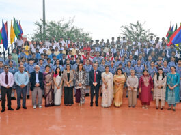 Dignitaries posing along with school management and participants during the programme.