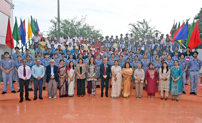 Dignitaries posing along with school management and participants during the programme.