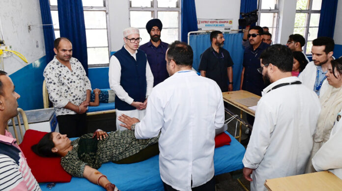 CM Omar Abdullah inquiring condition of an injured in GMC Udhampur on Wednesday.