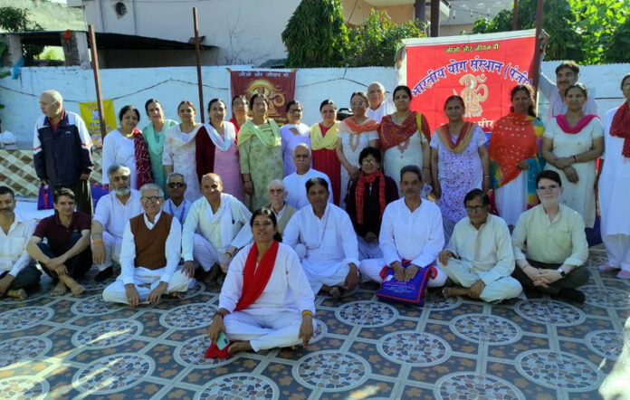 Participants posing along with management committee during a programme.