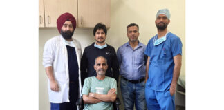Doctors at SMVD Narayana Hospital, Katra, posing with a patient on whom they performed a rare brain surgery.