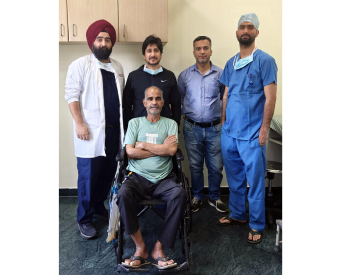 Doctors at SMVD Narayana Hospital, Katra, posing with a patient on whom they performed a rare brain surgery.