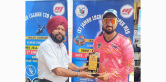 Dignitary presenting player of the match award.