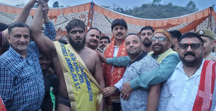 Wrestler posing along with dignitaries.