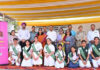 Students posing along with dignitaries during a programme.
