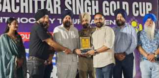 Organisers presenting memento to a dignitary during a programme.