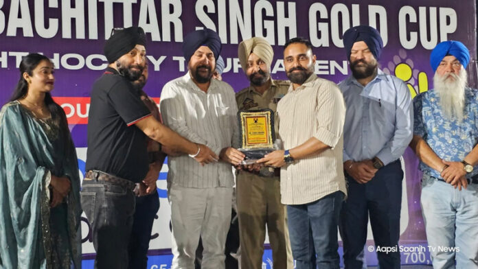 Organisers presenting memento to a dignitary during a programme.