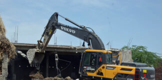 An illegal structure being demolished at Nikki Tawi area on Saturday. -Excelsior/Rakesh