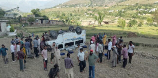An ill-fated Tempo Traveller near Aitti in Rajouri. -Excelsior/Imran