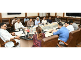 Minister Javed Rana chairing a meeting at Jammu on Monday.
