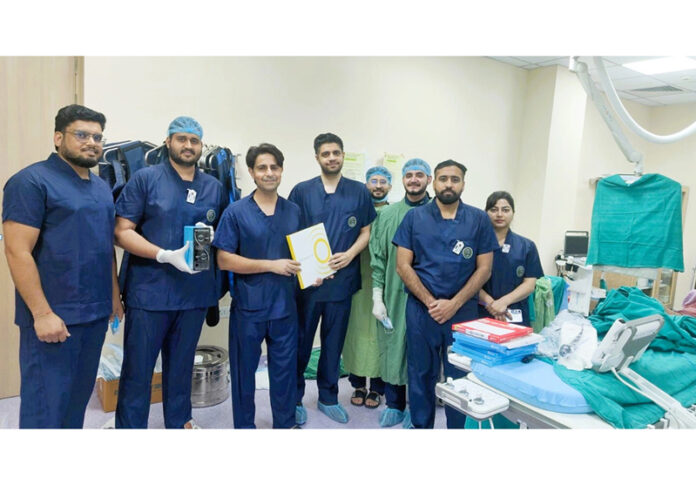 A team of doctors posing together after performing a complex life-saving cardiac procedure at AIIMS Jammu.