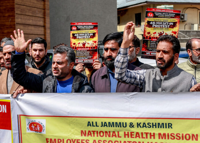 NHM employees from different parts of Kashmir during a protest in Srinagar on Wednesday. -Excelsior/Shakeel NHM employees from different parts of Kashmir during a protest in Srinagar on Wednesday. -Excelsior/Shakeel