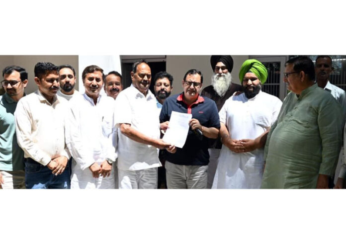 A delegation of Milk Cooperatives and farmers submitting memorandum to Agriculture & Cooperatives Minister Javid Dar.