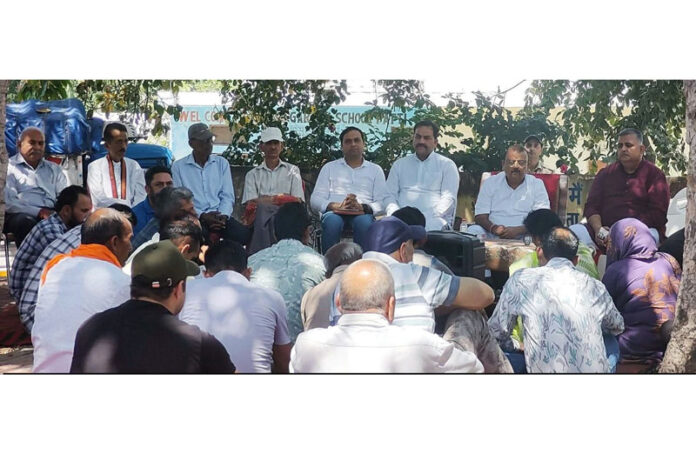 BJP MLA, Vijaypur Chander Parkash Ganga addressing a public meeting at village Patti on Sunday.
