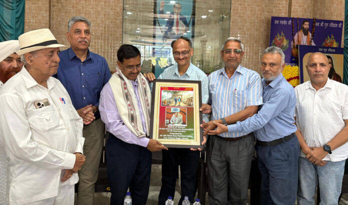 A dignitary being honoured souvenir at Guru Ravidass Gurudwara in Jammu on Sunday.