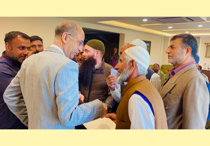 Advisor to the CM, Nasir Aslam Wani, listening to a delegation at his residence in Shivpora, Srinagar.