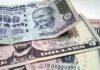 Rupee rises 14 paise to close  at 93.04 against US dollar
