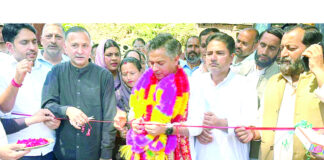 MLA inaugurating construction work on new minibus stand in Ramnagar on Tuesday.