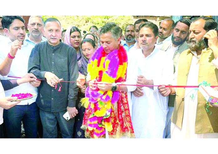 MLA inaugurating construction work on new minibus stand in Ramnagar on Tuesday.