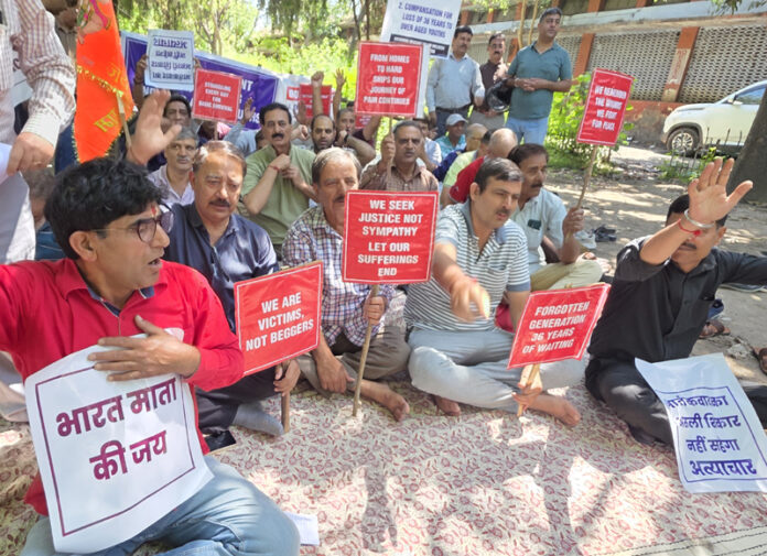 Relief holders and over-aged youth holding protest in front of Press Club Jammu on Wednesday. -Excelsior/Rakesh