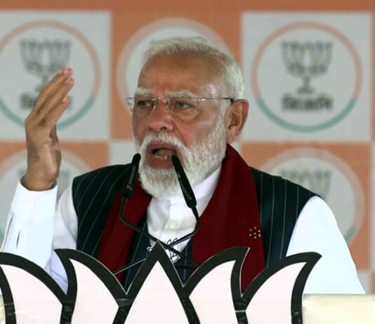 Prime Minister Narendra Modi addresses a Vijay Sankalp Sabha public meeting in Purulia, West Bengal, on Sunday. (UNI)