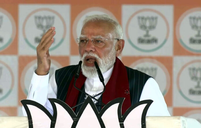 Prime Minister Narendra Modi addresses a Vijay Sankalp Sabha public meeting in Purulia, West Bengal, on Sunday. (UNI)
